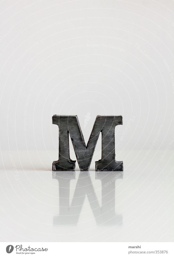 M wie... Elegant Style Leisure and hobbies Sign Characters Signs and labeling Gray Mirror image Reflection Letters (alphabet) White Typography Colour photo