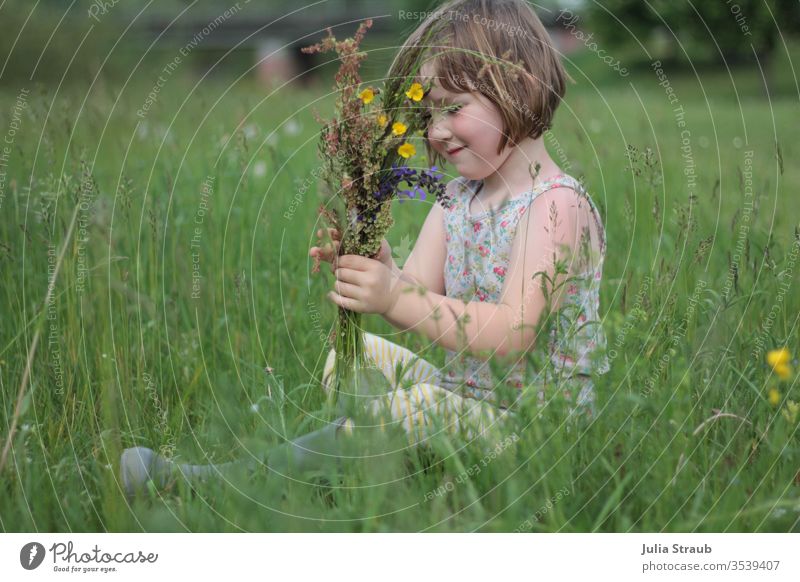 Girl sitting in the meadow with a bunch of flowers tall grass wildflower meadow wild flowers girl Bouquet Rubber boots Sit To enjoy Pick buttercups stalks