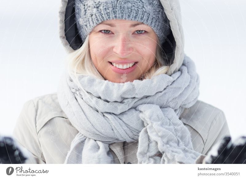 Portrait Of Teenage Girl With Snowflake In Winter Stock Photo