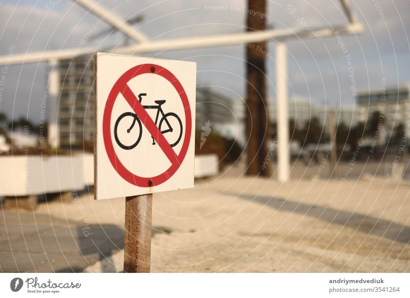 beach traffic sign not to enter with a bicycle. selective focus. the sign on the beach is prohibited by bicycle bike symbol red transportation warning forbidden