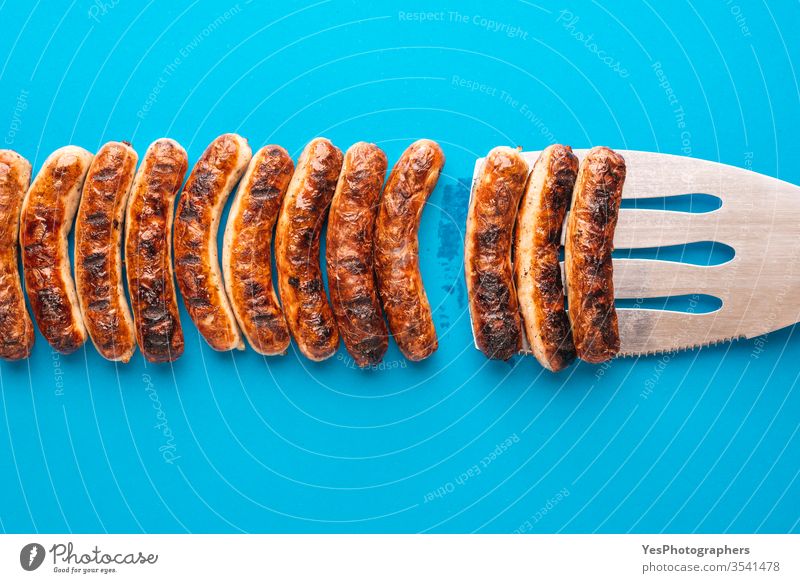Grilled german sausages. Nuremberger bratwurst. above view authentic barbeque bavaria bavarian bbq blue background brown christmas cooked cuisine delicious