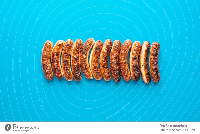 Grilled nuremberger bratwurst. German sausages top view above view authentic barbeque bavaria bavarian bbq blue background brown christmas cooked cuisine