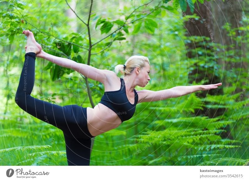 Lady practicing yoga in the nature. outdoor park woman harmony balance pose relaxation female healthy exercise girl lifestyle young person meditation body