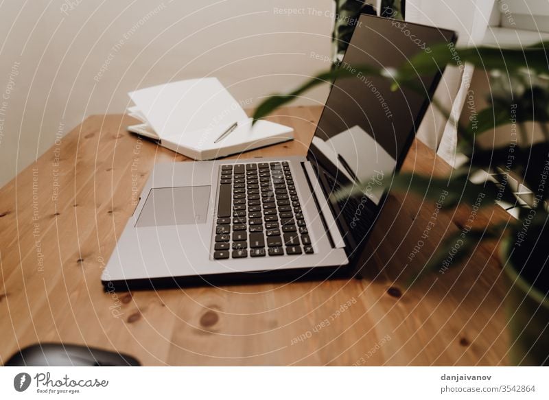 An open laptop to an old wooden table. computer business keyboard office notebook technology desk white screen internet isolated pc monitor work desktop