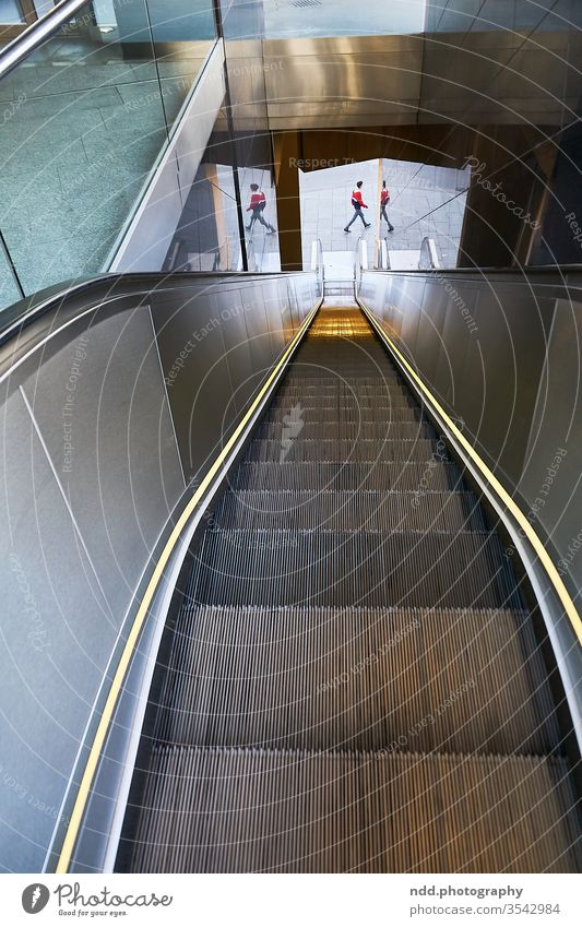 lonely escalator with a mirrored person Escalator Mirror single human Exit route Loneliness inner turmoil depression Depression torn split personalities