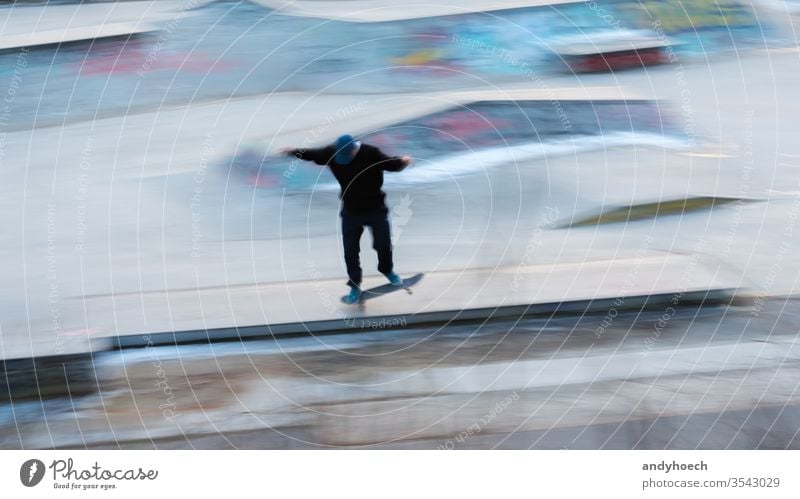 A skater in motion at a stunt action active activity Art awesome balance Berlin blur effect blurry board city citylife cityscape cool culture equipment extreme