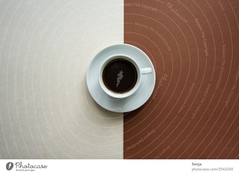 A white cup of coffee and a saucer on a white and brown background, contrasts Coffee Beverage Espresso Black Strong Aromatic Hot Cup Saucer Brown White