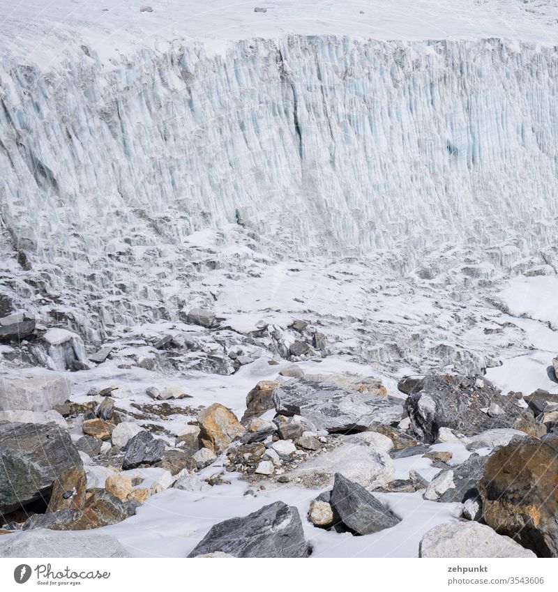 Section of a glacier edge and coloured rocks lying below Glacier ice Rock Glacier tongue Glacier breakup Nepal Himalayas Solukhumbu Landscape Mountain