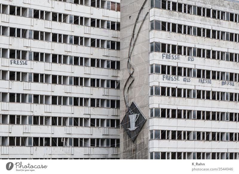 old illuminated advertising on a DDR panel construction in Berlin Facade Neon sign GDR Prefab construction German House (Residential Structure) at home