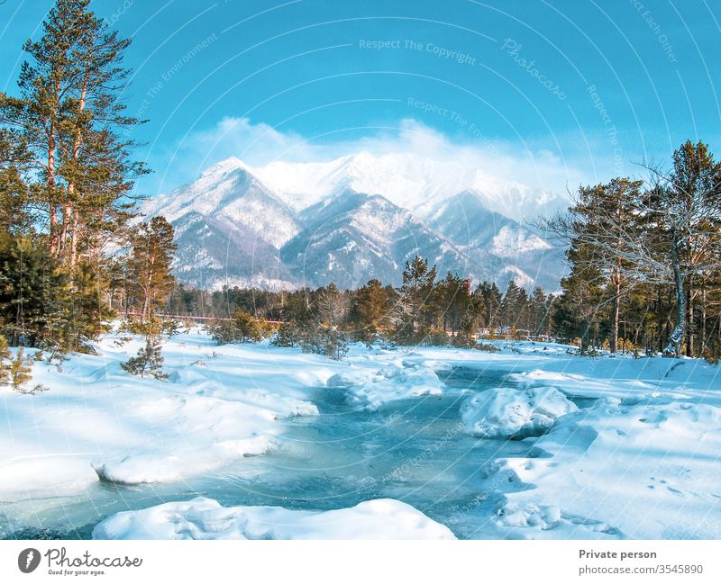 colorful view of the snow-white mountain and the river, wild life, winter background, copy space for text,  copy space adventure arshan beautiful blue buryatia