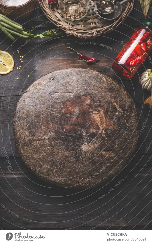 Round cutting board and ingredients around background Chili closeup concept cooking copy diet empty food fresh garlic glass healthy home home cooking jar