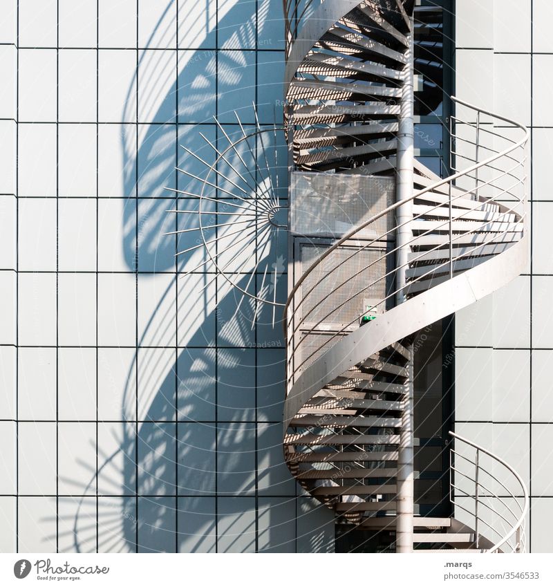 spiral staircase Winding staircase Stairs Architecture Manmade structures Spiral Building Facade Fire ladder Shadow Structures and shapes Metal steps