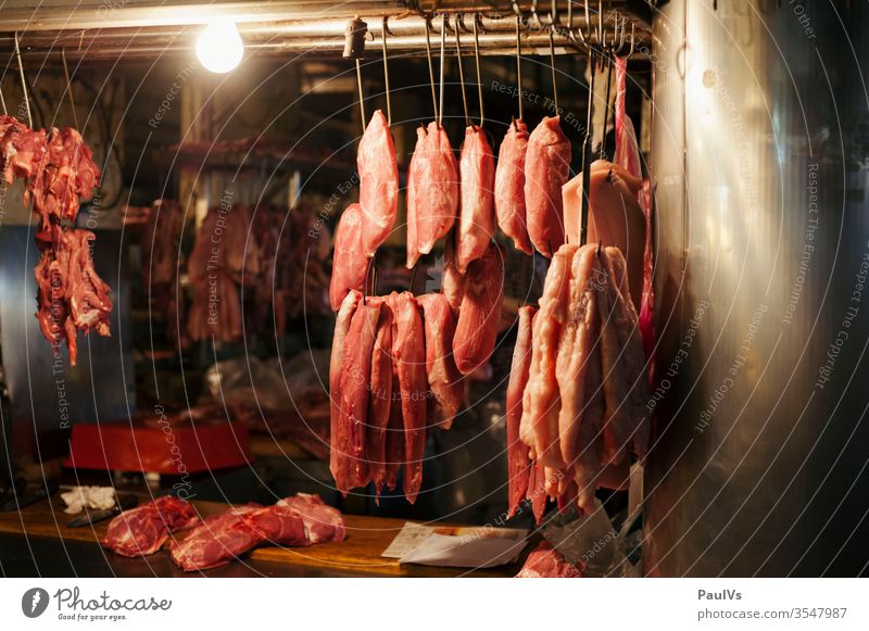 Fresh Meat Hang on Spike in Asain Market. Stock Photo - Image of loin,  roast: 67932000