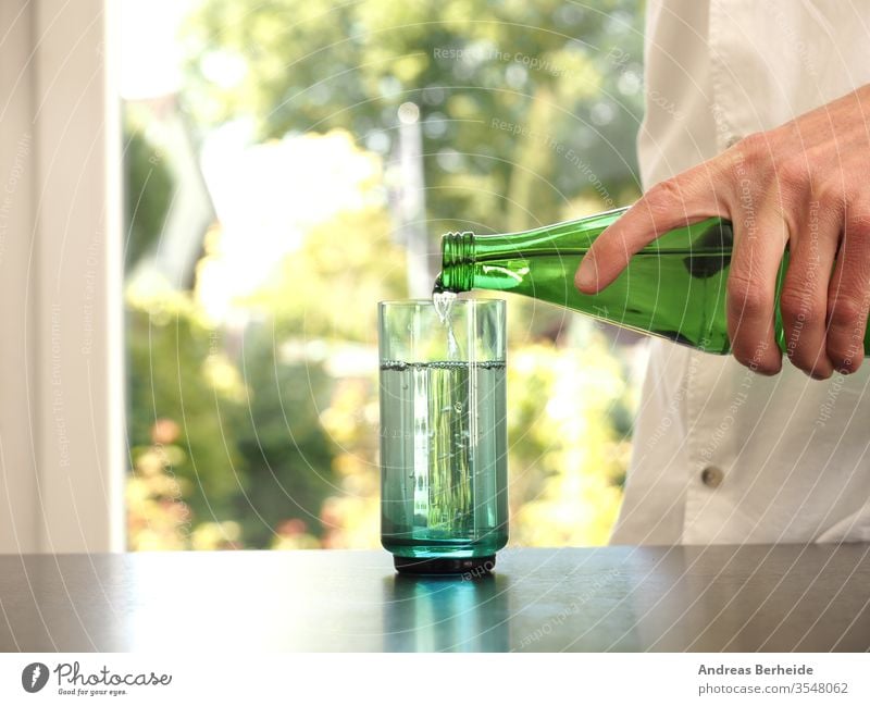 https://www.photocase.com/photos/3548062-mid-aged-man-pouring-water-into-a-glass-purity-photocase-stock-photo-large.jpeg