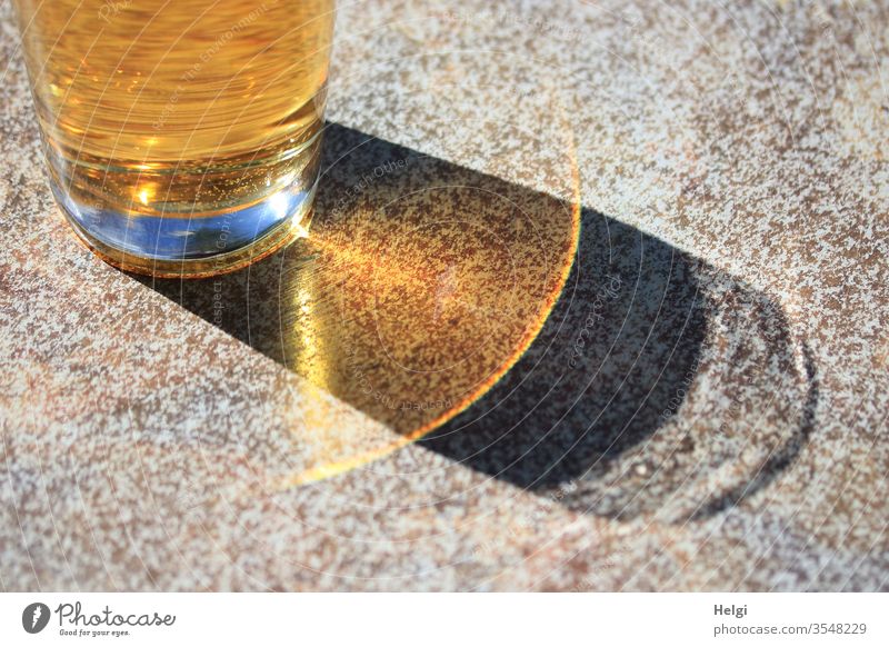 Soft drink in the sunshine with shadow and reflection Beverage Glass Apple spritzer Cold drink Table Light Shadow Sunlight Illuminate Exceptional Detail Yellow