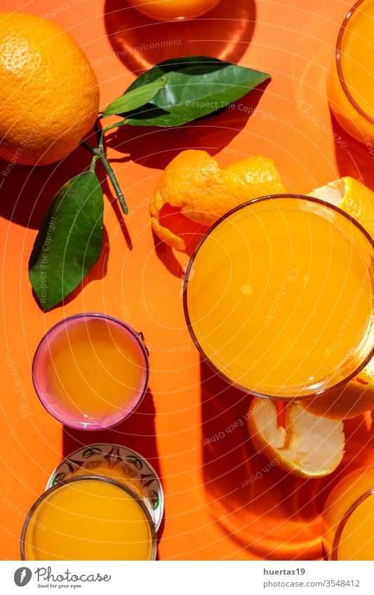 Orange juice from above on coloured backgrounds. oranges Fresh fruit Healthy Food Citrus fruits Juice Mature Drinking natural Slice sunligth Juicy Beverage