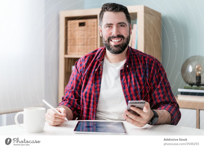 Young man working from home graphic business technology modern young interior internet job workplace table freelance male house room icon workspace hipster
