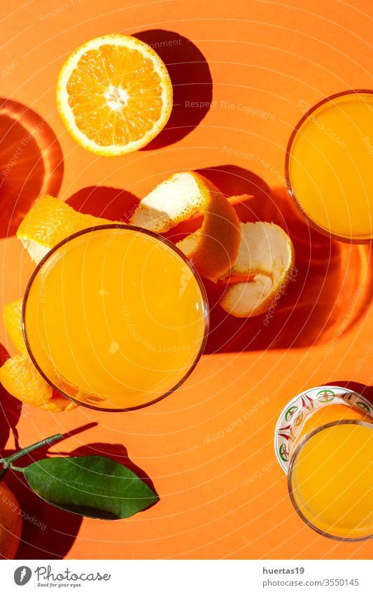 orange juice from above on colored backgrounds. oranges fresh fruit healthy food citrus ripe drink natural slice sunligth juicy beverage glass summer table