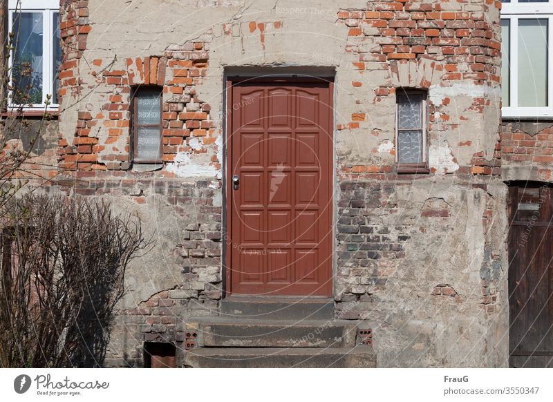 old | the house -the door is newer Facade House (Residential Structure) Brick facade bailer Old front door Ravages of time Window curtains stair treads dwell