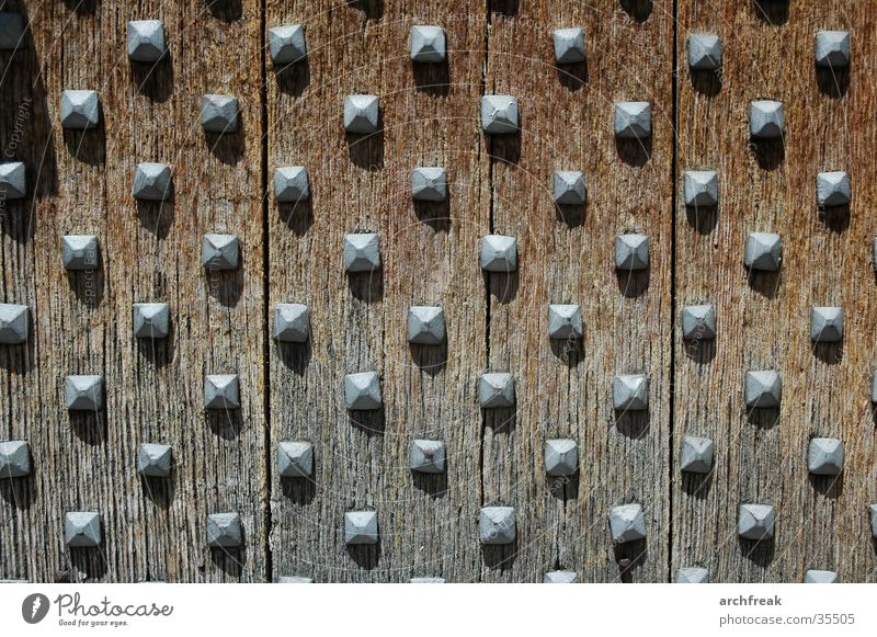 Medieval nubs of emotion... Church door Spain Catalonia Wood Iron Structures and shapes Oak tree Nail House of worship Medieval times Romanesque style Sun