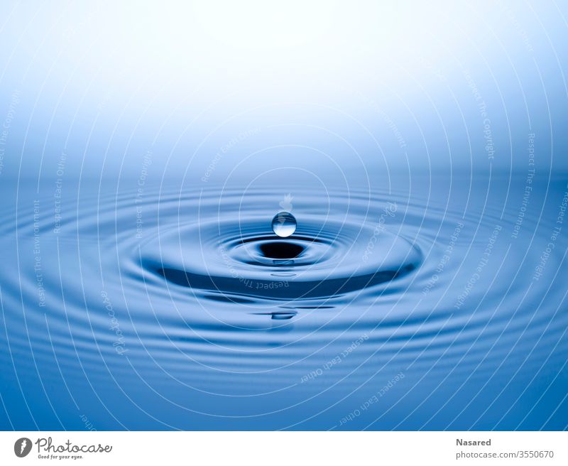 Drops of water on blue water Water Surface of water Water reflection Blue To fall plummeting