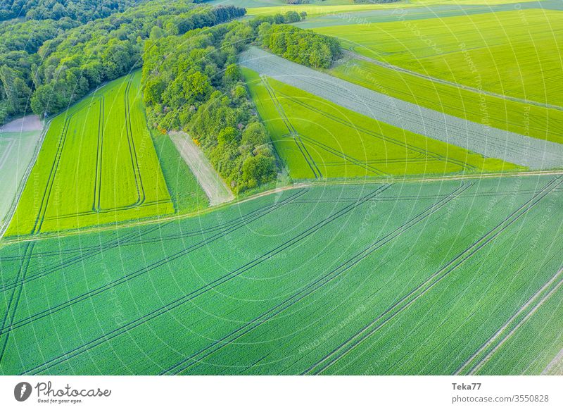 meadows and fields from above background agricultural agricultural way tractor tractor path field background meadow background air aerial view aerial photo