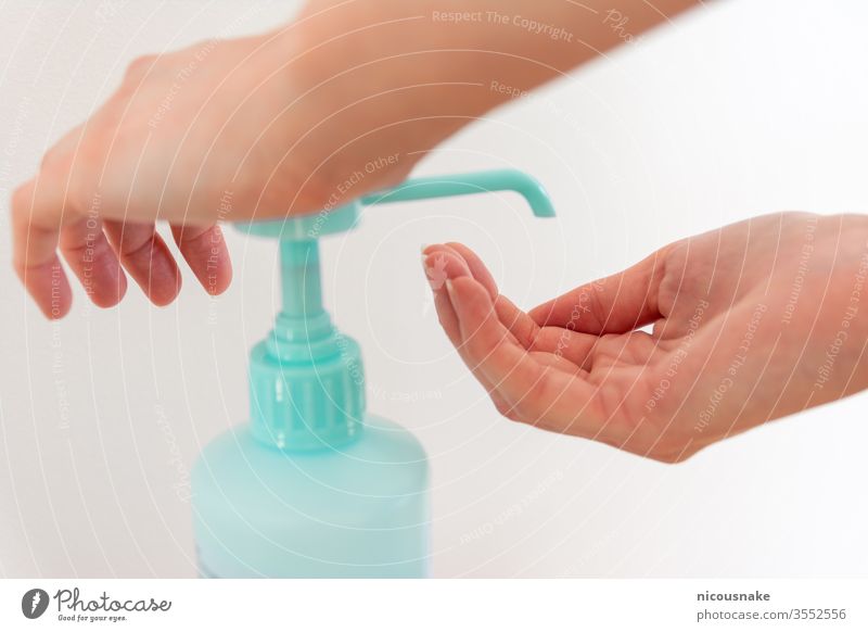 Woman washing hands with hand sanitizer alcohol antibacterial to prevent germs, bacteria and avoid coronavirus infections disinfectant outbreak pump covid19