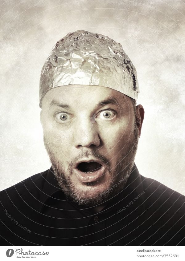 shocked man with aluminum hat - conspiracy theories aluminium hat Aluminium hat carrier Conspiracy theory Shock aluminium foil Hat Protection mind control