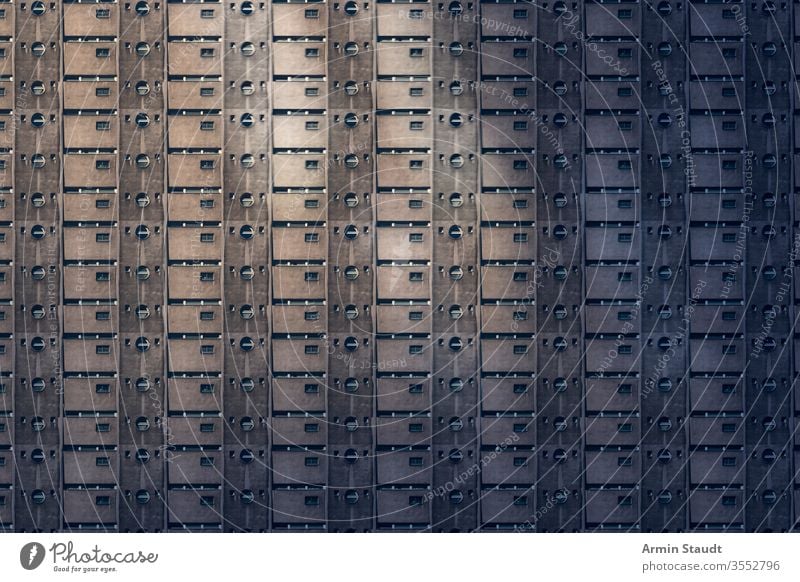 architectural pattern, prison like concrete facade of a miserable house overpopulation conformity anonymity anonymous building architecture future background