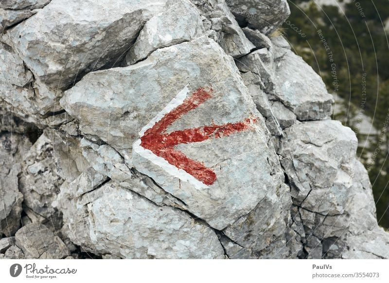 Directions red arrow on rock stone hiking trail Arrow off route Alpine Austria red white mountain Mountain Mountaineering Alps Hiking Peak Nature Climbing Stone
