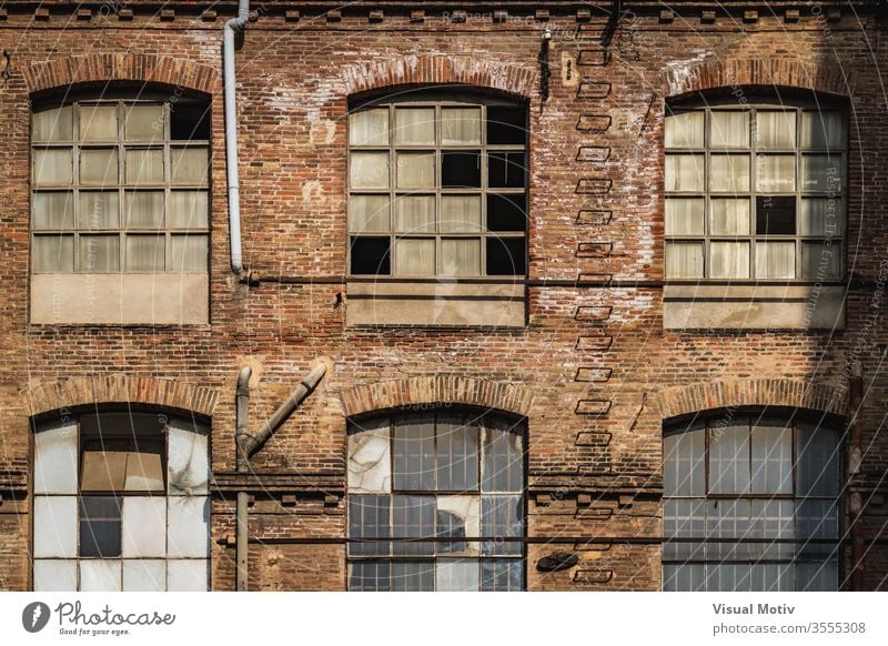 Windows of an old textile factory at the afternoon light building facade industry windows architecture architectural architectonic urban metropolitan