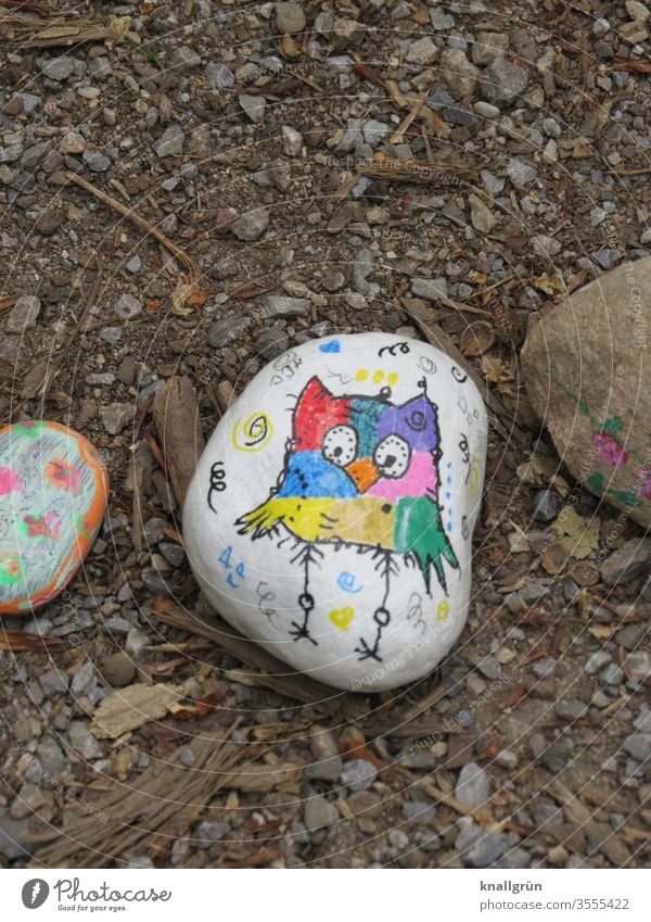 Lucky stone painted with a colourful owl on a white background Lucky Stones Leisure and hobbies Creativity Painting (action, artwork) Draw Art Multicoloured