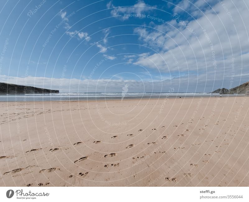 Wide angle shot at the sandy beach with rocks and blue sky Sandy beach Beach rock salt Rock Coast Ocean Vacation & Travel Nature Landscape Water