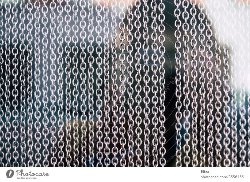 A curtain with many chains made of metal, which consist of many chain links Chain Chain links Metal Metal chains Safety Team Attachment Connectedness Strong
