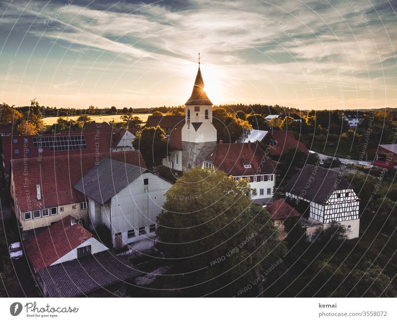 Village with village church in the evening light UAV view droning Light Back-light Sun Sunlight Evening sun warm country rural Idyll Country life Church