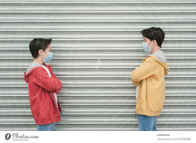 two kids with medical mask maintain social distancing coronavirus children epidemic pandemic quarantine prevention friendship brothers symptom medicine health