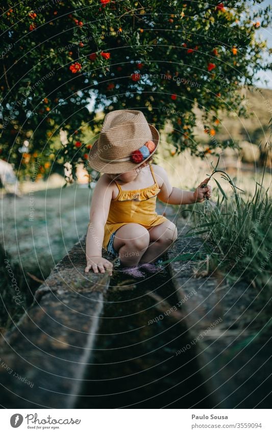 Child with hat Pomegranate Nature Hat Summer Summer vacation Spring Vacation & Travel Exterior shot Infancy Colour photo Lifestyle Day Happiness Toddler