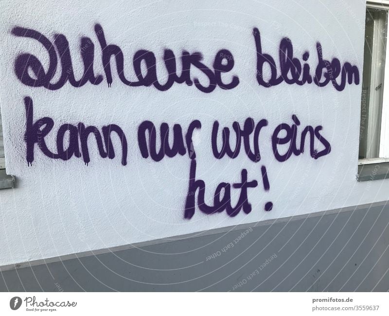 Graffiti: "only those who have one can stay home!" Seen on a house wall. Photographer: Alexander Hauk Homelessness Art Wall (building) purple protest
