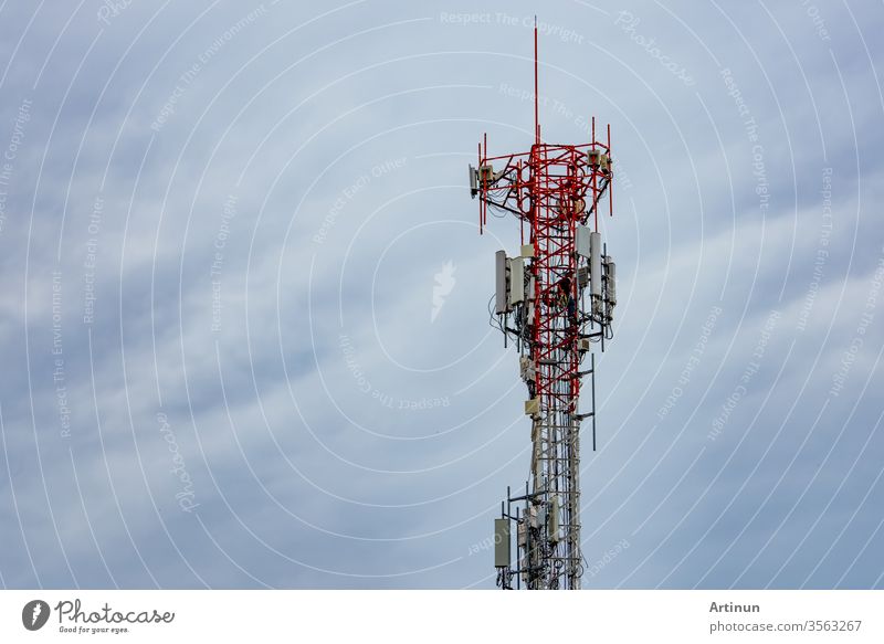 Telecommunication tower with blue sky and white clouds. Worker installed 5g equipment on telecommunication tower.Communication technology. Telecommunication industry. Mobile or telecom 4g network.