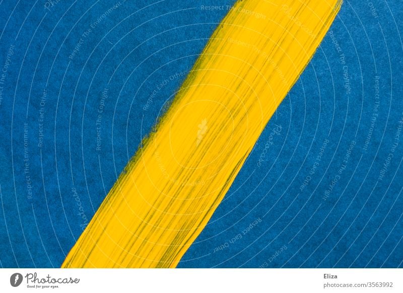 Yellow diagonal brush stroke on a blue background. Graphic. Background. surface Colour Diagonal Brush stroke dash Line Subsoil Divided Abstract unostentatious