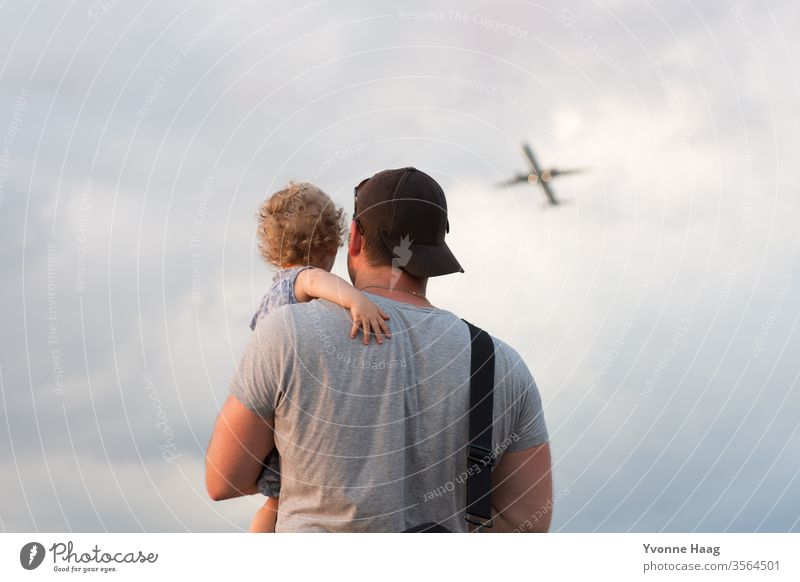 Father and child watching an airplane at the Hinmel Beach Sky Coast Clouds Colour photo Nature Wind Exterior shot Landscape Water Bad weather Climate