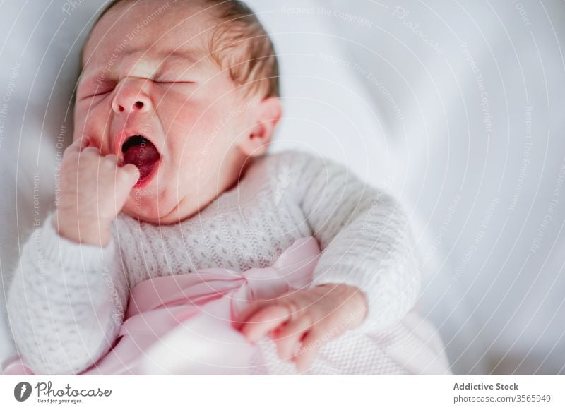 little girl yawning