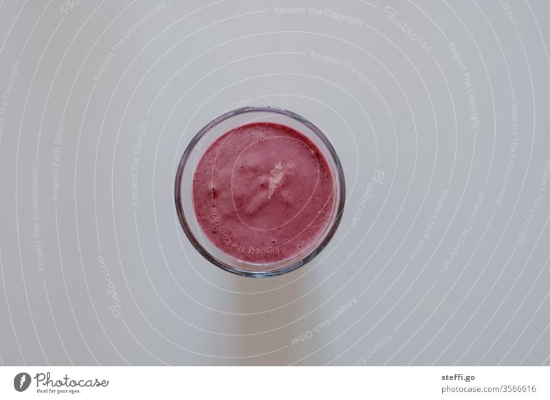 pink juice in a glass on a neutral background from a bird's eye view Drinking food and drink Healthy Healthy Eating salubriously smoothie Pink Red Food