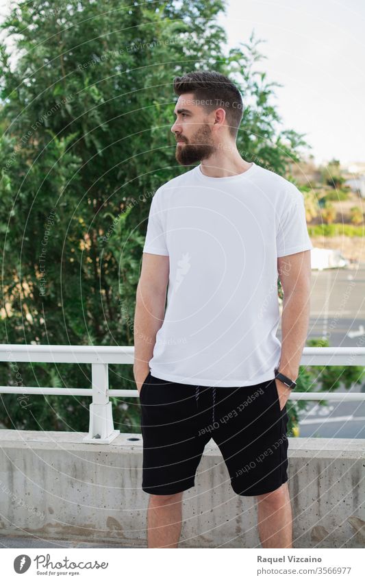 Casual model man outdoors, Very handsome, with a white t-shirt and urban style portrait young happy smiling person people park casual smile guy face men beard