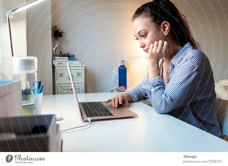 woman sitting at an office desk and working with a computer