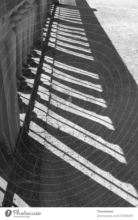 Strict order Handrail cordon Shadow Sandstone Metal lines Lanes & trails off Exterior shot Deserted Safety Light Black & white photo