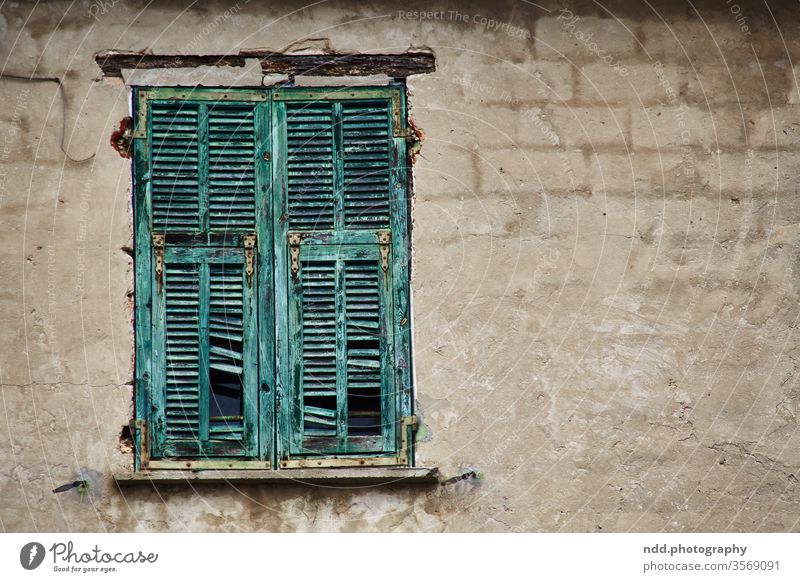 Derelict shutter on unplastered wall Window shutters Facade Old Decline Wall (building) derelict house Broken Transience Colour photo Deserted Subdued colour