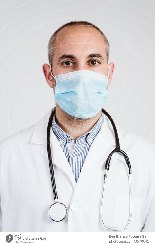 close up view of doctor man wearing protective mask, gloves and stethoscope. Coronavirus Covid-19 concept portrait professional corona virus hospital working