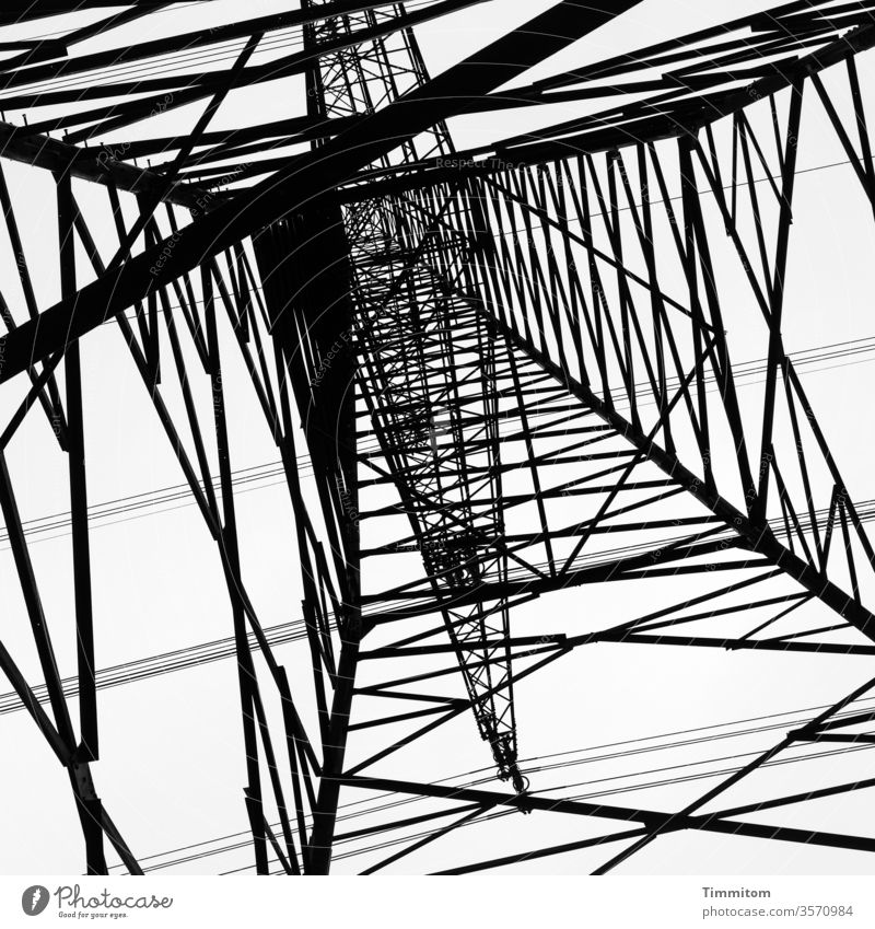 Stand under the power pole and imagine that up there in the square Electricity pylon Pole Metal Construction Sky Technology Energy industry