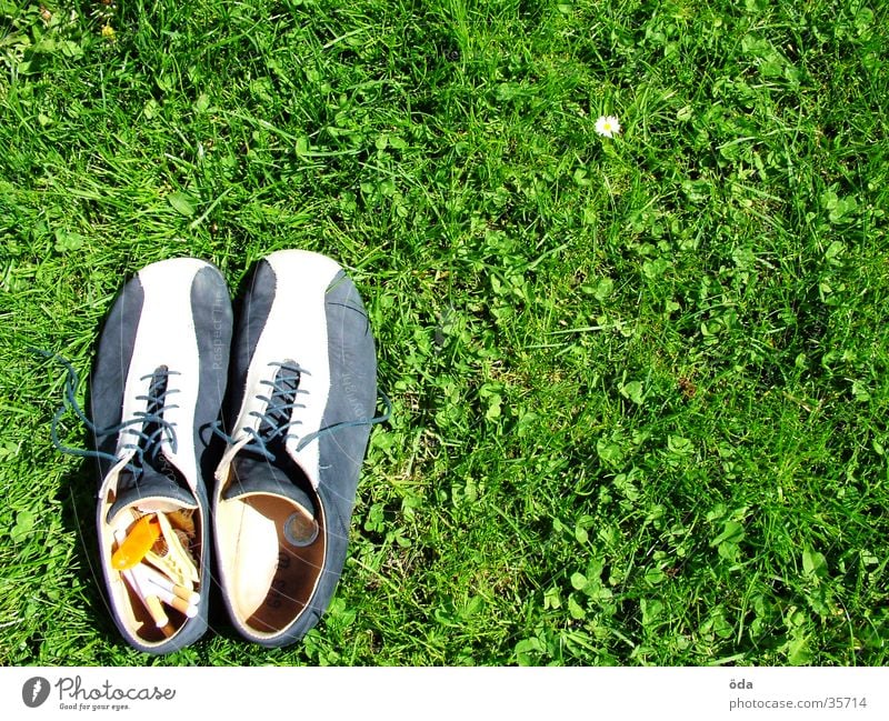 Shoes lower left #2 Footwear Grass Going Left Under Cigarette Green Meadow Obscure